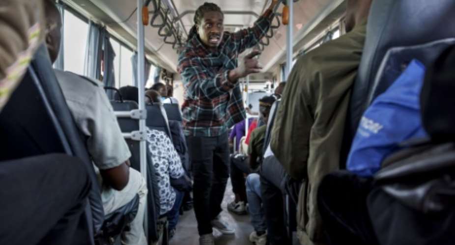 Willie Oeba brings his political rhymes straight to Nairobis commuters.  By Tony KARUMBA (AFP)