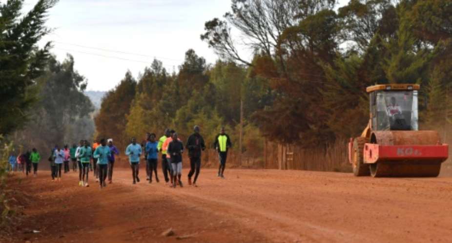 With athletics facilities either closed or under construction, Kenyan athletes train along a dirt road at Iten, a town world-famous for its high-altitude training at 2,400 metres 7,874 feet above sea level.  By TONY KARUMBA AFP