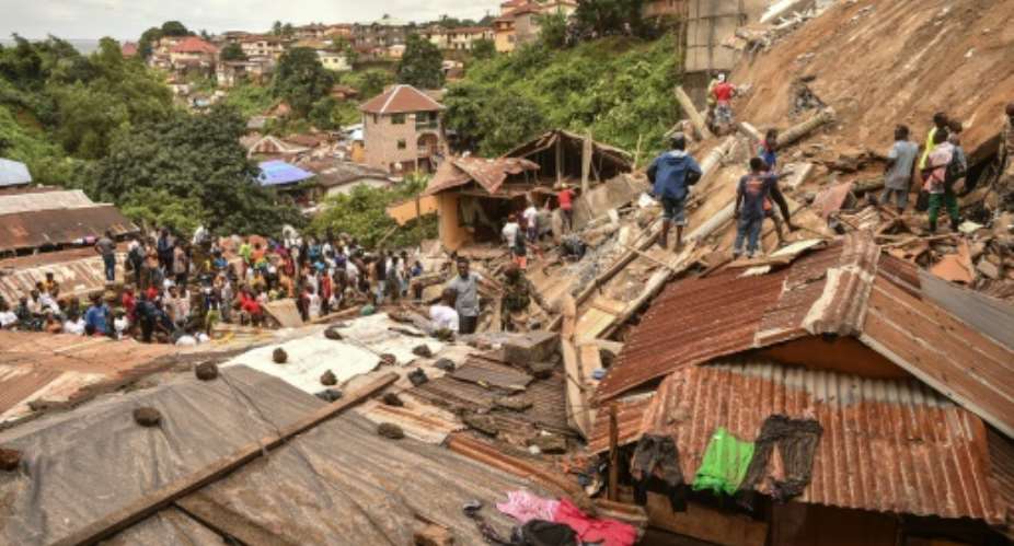 Witnesses interviewed by AFP said that dozens of people lived in the building.  By Saidu BAH (AFP)