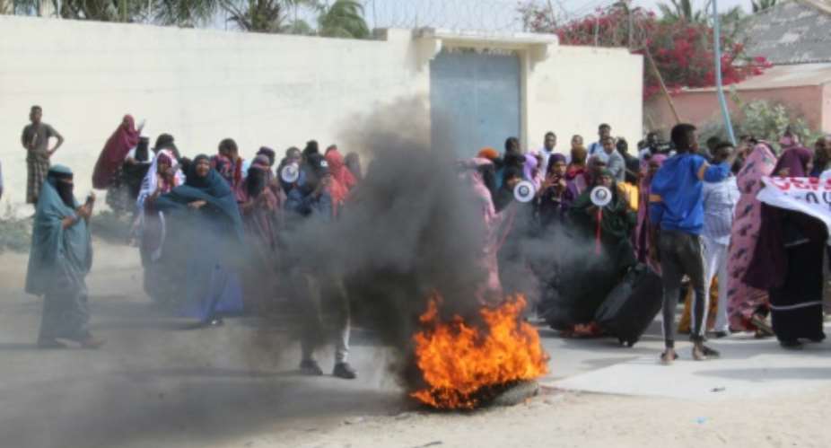 Women take part in a demonstration against the Somali President Mohamed Abdullahi Mohamed, better known by his nickname Farmajo, in Mogadishu on December 15, 2020 accused of interference in the electoral process..  By STRINGER AFP