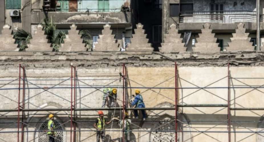 Work on Cairo's 13th-century al-Zahir Baybars mosque in the neglected Islamic quarter resumed last month after being halted during the turmoil that followed the ouster of the dictator Hosni Mubarak in 2011.  By Khaled DESOUKI AFP