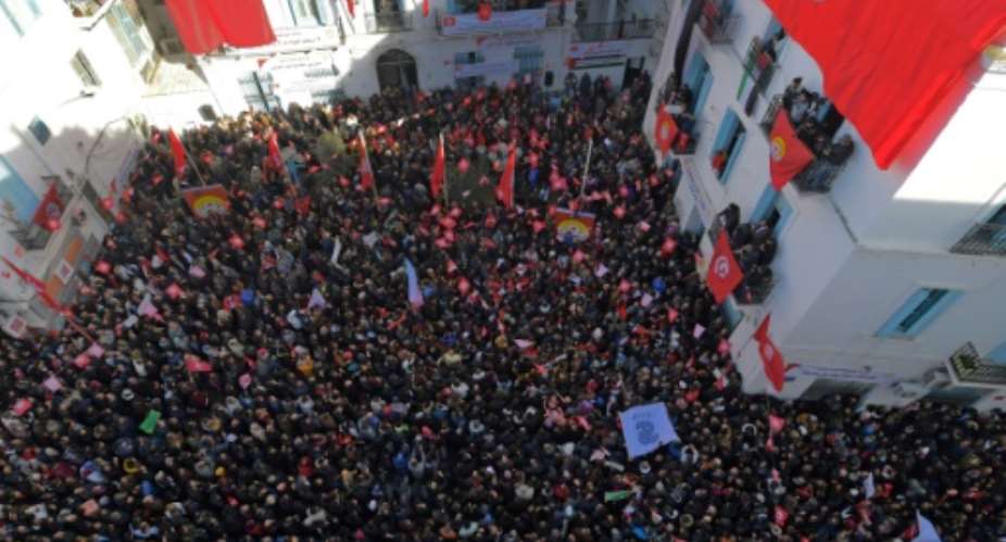 Workers gather at the headquarters of the powerful Tunisian General Labour Union during a strike on January 17, 2019.  By FETHI BELAID AFP