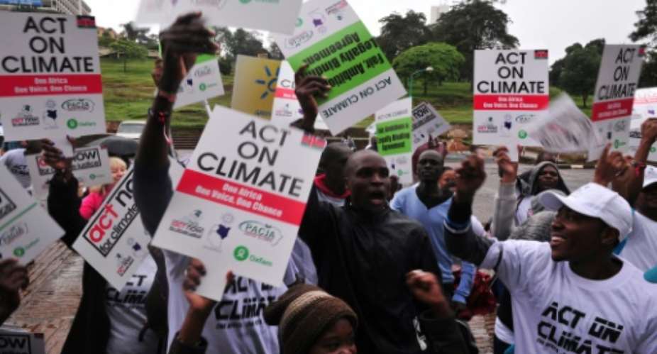 Kenyans call for climate justice at a demonstration on November 14, 2015, in Nairobi, as droughts and food-price increases illustrate the costs of climate change across Africa.  By Simon Maina AFPFile