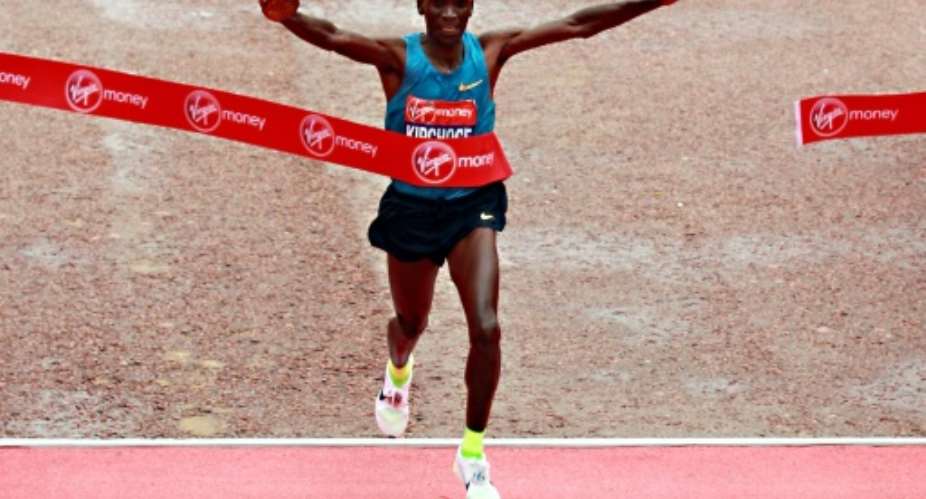Kenyan elite runner Eliud Kipchoge crosses the finish line to win the men's 2015 London Marathon in central London on April 26, 2015.  By Sean Dempsey AFPFile