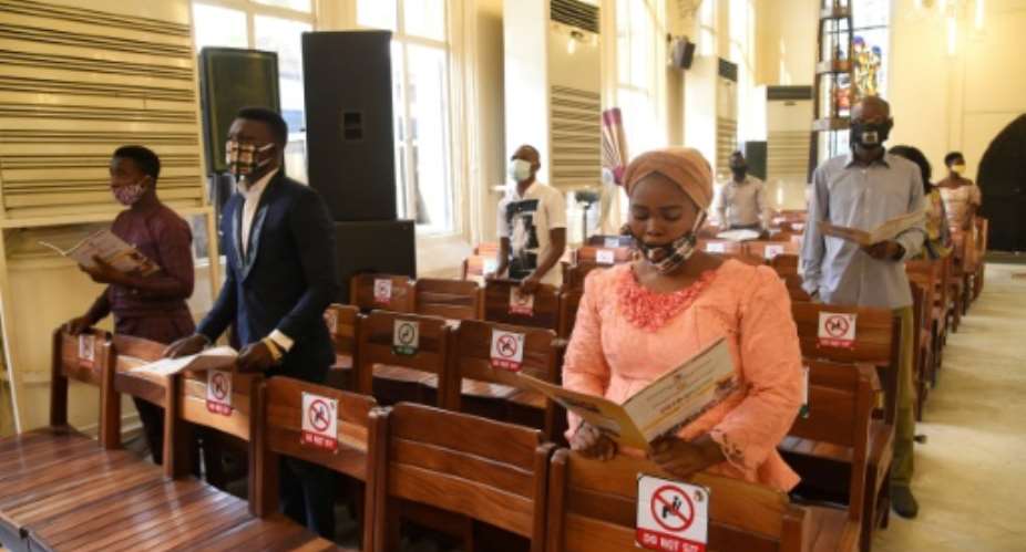 Worshippers sing at Mass in August 2020 at a church in Lagos, Nigeria, which has been put on a US blacklist over concerns on religious freedom.  By PIUS UTOMI EKPEI AFPFile