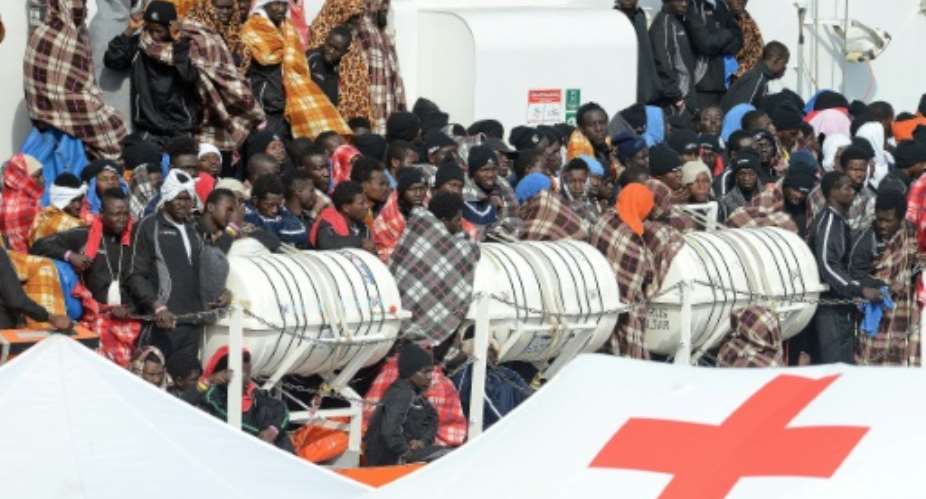 Would be immigrants wait to disembark in the port of Catania, on the island of Sicily on March 21, 2017 from the ship Aquarius following a rescue operation in the Mediterranean sea, where some 946 would be immigrants have been rescued.  By Giovanni ISOLINO AFPFile