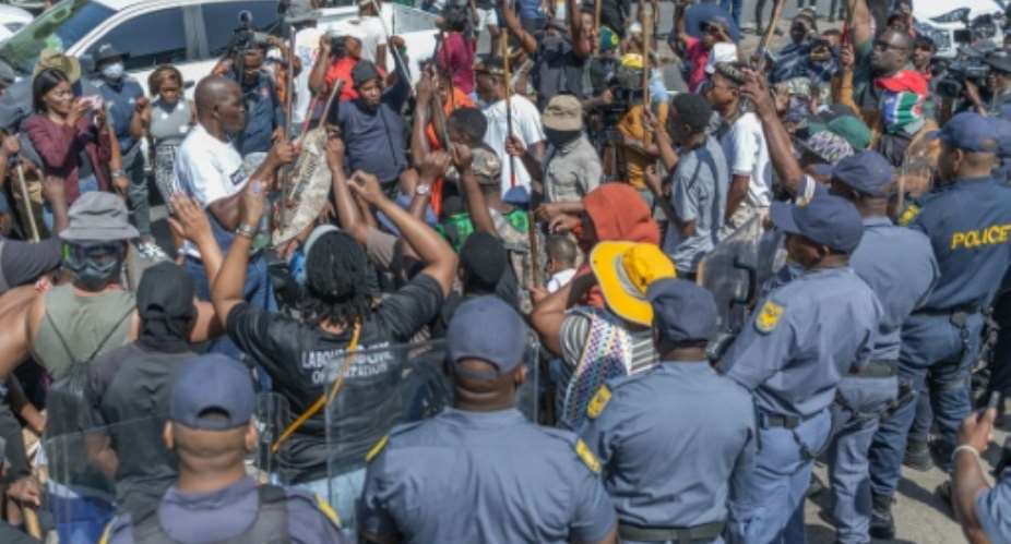 Xenophobic groups hostile to undocumented migrants demonstrated in Durban and Johannesburg.  By RAJESH JANTILAL (AFP)