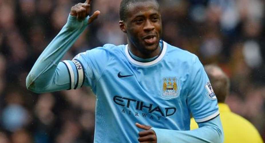 Manchester City's Ivorian midfielder Yaya Toure celebrates after scoring during the English Premier League football match between Manchester City and Fulham in Manchester, England on March 22, 2014.  By Andrew Yates AFPFile