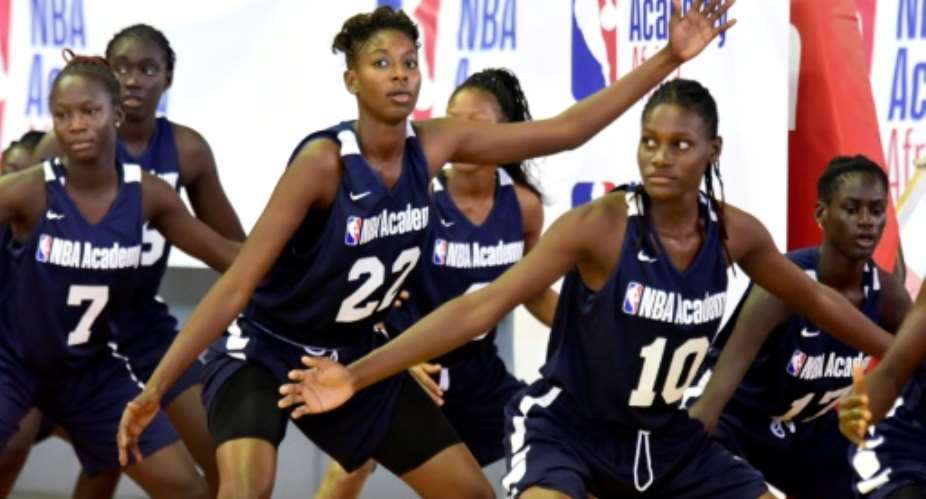 Young African women participate in the NBA Academy basketball camp at Maurice Ndiaye Stadium in Dakar.  By SEYLLOU AFP