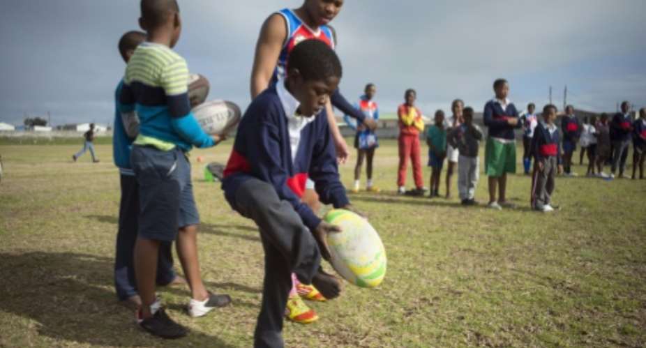 In the sprawling township of Khayelitsha in Cape Town, volunteers are introducing young black children to a sport dominated by whites under apartheid.  By Rodger Bosch AFP