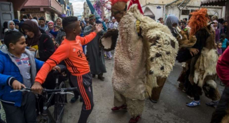 Young Moroccans celebrate the Boujloud festival in the Sidi Moussa district of Sale near Rabat, on October 27, 2018.  By FADEL SENNA (AFP)