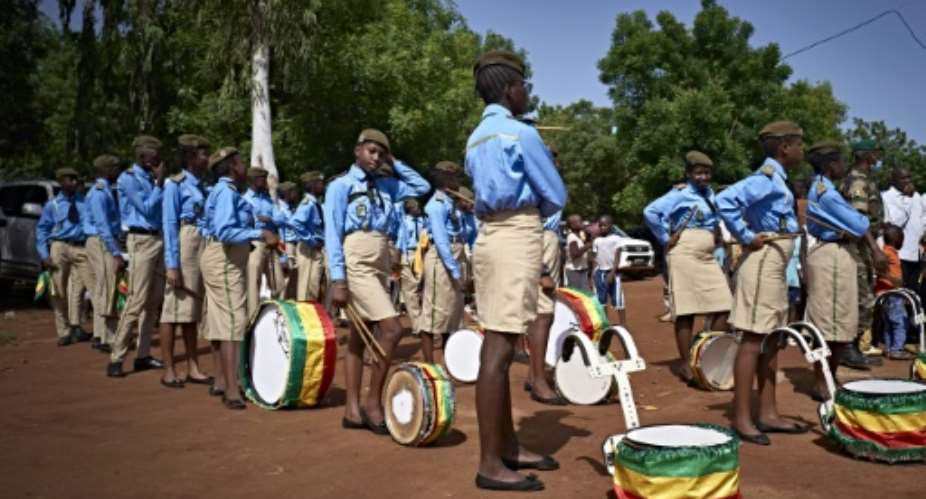 Young musicians get ready for the parade at the ceremony marking the anniversary of Mali's independence in Bamako.  By MICHELE CATTANI AFP