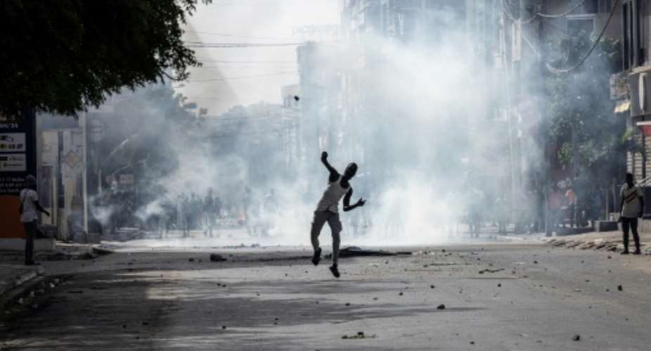 Young people clashed with security forces, with stones and tear gas being thrown.  By JOHN WESSELS AFP