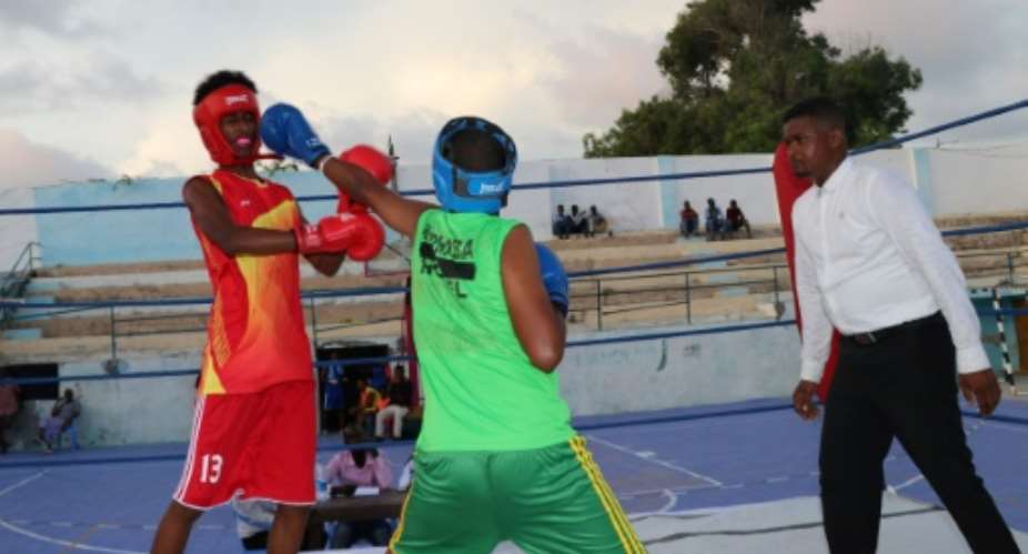 Young pugilists spar in war-torn Somalia's first boxing competition in more than three decades.  By ABDIRAZAK HUSSEIN FARAH, ABDIRAZAK HUSSEIN FARAH AFP