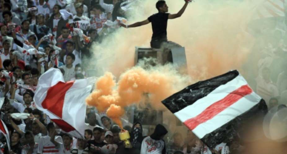 Egyptian fans of Zamalek club celebrate during a match on November 10, 2011.  By Khaled Desouki AFPFile