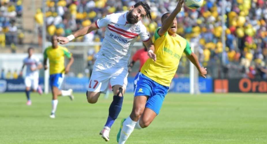 Zamalek's Basem Abdall L goes head to hand with Mamelodi Sundowns' Wayne Arendse in the CAF Championship final in Pretoria on October 15, 2016.  By STRINGER AFPFile