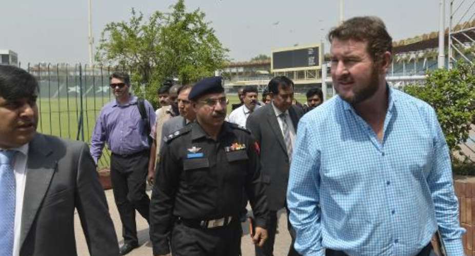 Zimbabwe Cricket Managing Director and head of the security delegation Alistair Campbell right inspects the Gaddafi Cricket Stadium with Pakistani cricket officials in Lahore on May 6, 2015.  By Arif Ali AFPFile