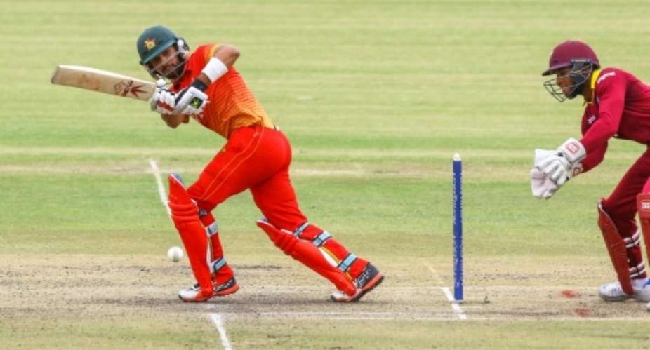 Zimbabwe batsman Sikanda Raza left in action against the West Indies during a one-day international in Bulawayo, on November 26, 2016.  By Jekesai Njikizana AFP