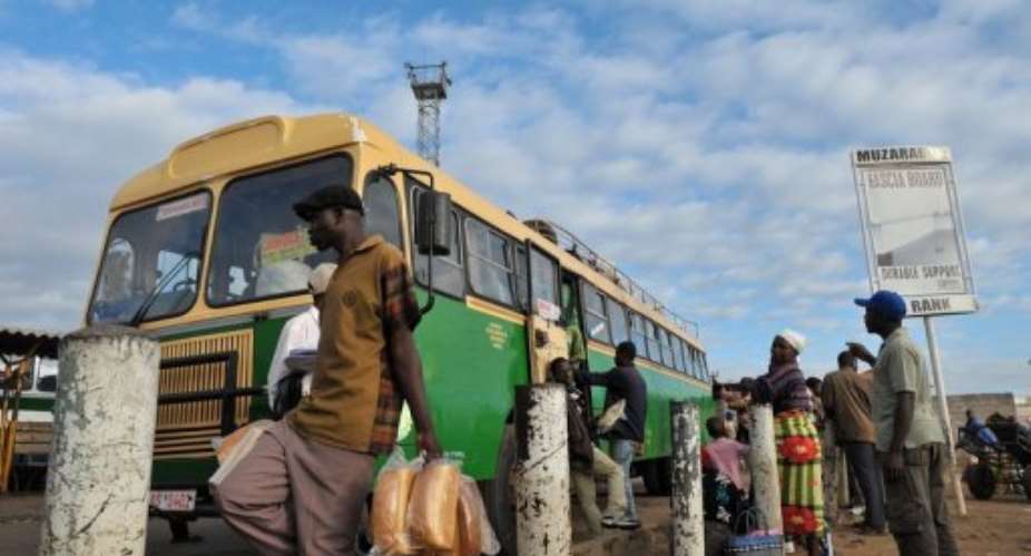 A bus driver in Zimbabwe was one of at least 21 people who died when his vehicle failed to negotiate a curve.  By Alexander Joe (AFP)