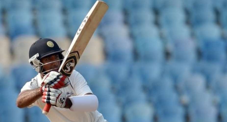 Cheteshwar Pujara plays a shot against England at The D.Y. Patil stadium in Navi Mumbai on November 4, 2012.  By Punit Paranjpe (AFP)
