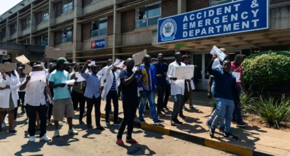 Zimbabwe junior doctors protested Sunday over the abduction of their union's leader, Dr Peter Magombeyi.  By Jekesai NJIKIZANA AFP