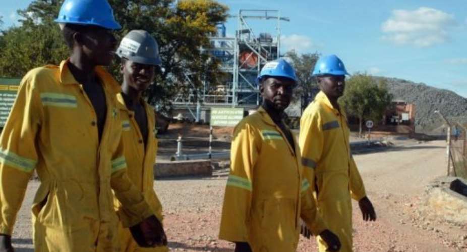 Workers return from a shift underground at the Mimosa Mine in Zvishavane.  By Jekesai Njikizana (AFP/File)