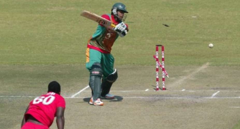 Brian Vitori takes the wicket of Bangaldesh's Abdur Razzak in a ODI at Harare last month.  By Jekesai Njikizana AFP