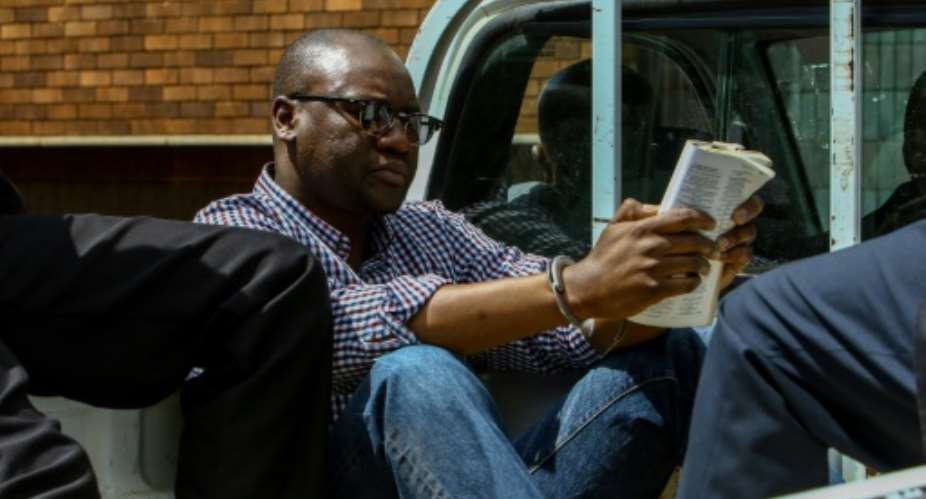 Zimbabwe Pastor Evan Mawarire is driven to court in Harare to face charges of subverting the government and inciting public violence.  By Jekesai NJIKIZANA AFP