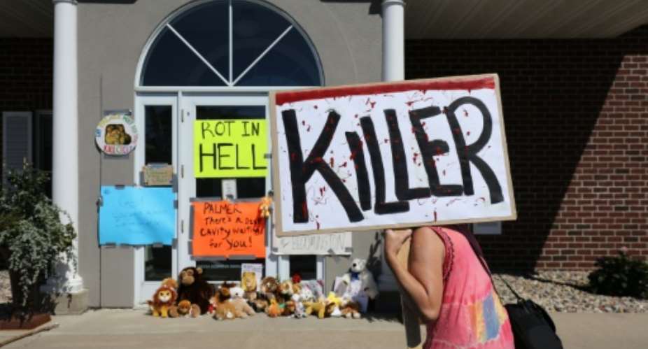 Walter Palmer's dental practice in Minnesota has been the scene of angry protests after he admitted to killing 'Cecil the lion' during a hunting expedition to Zimbabwe.  By Adam Bettcher GettyAFPFile