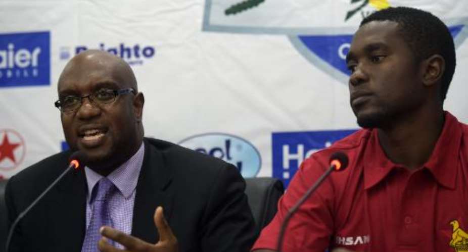 Zimbabwes cricket chief Ozias Bvute (left) and captain Elton Chigumbura answer questions during a press conference at the Gaddafi Cricket Stadium in Lahore, on May 19, 2015.  By Aamir Qureshi (AFP)
