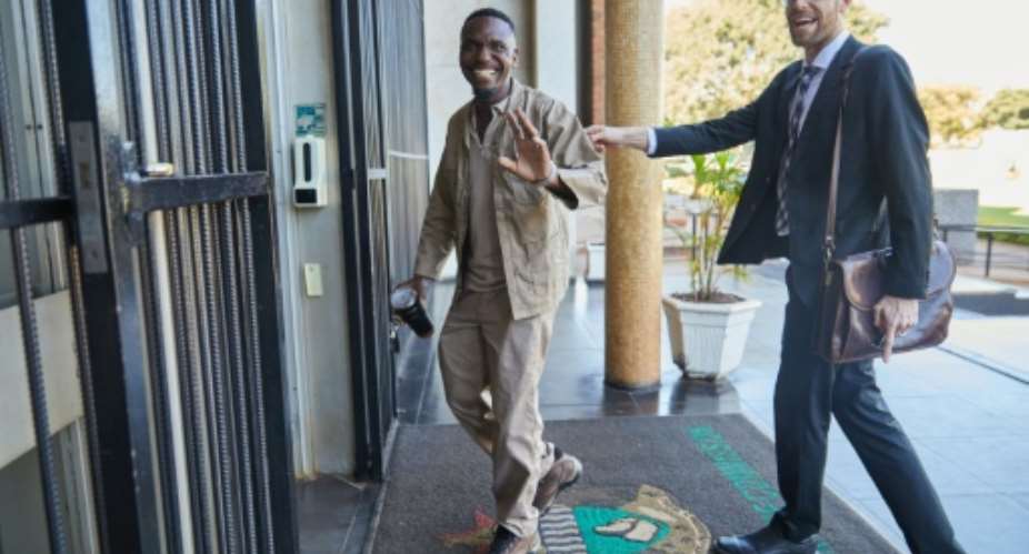 Zimbabwean journalist Blessed Mhlanga (L) was jailed after interviewing a critic of President Emmerson Mnangagwa.  By Jekesai NJIKIZANA (AFP)