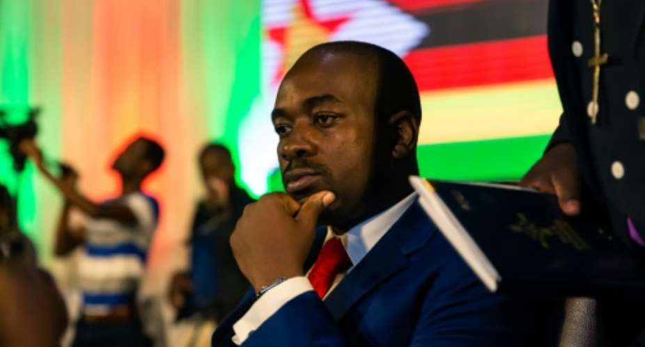 Zimbabwean opposition leader Nelson Chamisa of the MDC Alliance listens to participants during a prayer as part of a meeting organized by a coalition of Christian churches to facilitate dialogue between political party leaders.  By Jekesai NJIKIZANA AFPFile