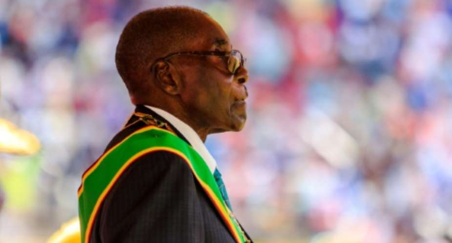 Zimbabwean President Robert Mugabe,93, says he is 'not dying' and that his 'heart and liver are very firm'.  By Jekesai NJIKIZANA AFPFile