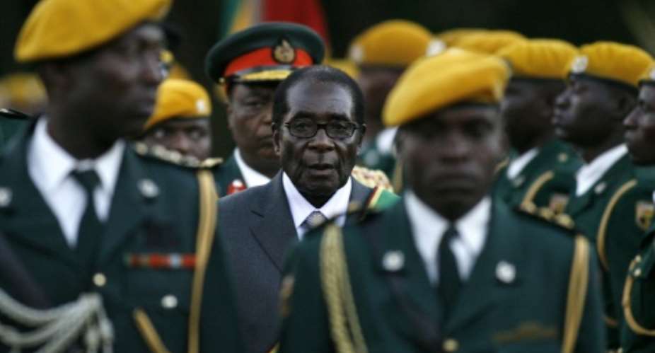 Zimbabwean President Robert Mugabe was left a 'broken soul' when the army turned against him in 2017.  By ALEXANDER JOE AFP