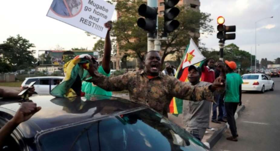 Zimbabweans took to the streets to celebrate when Robert Mugabe stepped down as president after 37 years in the power seat.  By Marco LONGARI AFPFile