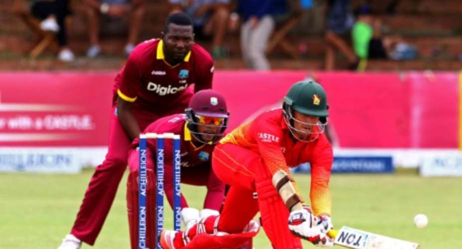 Zimbabwe's batsman Craig Ervine right plays a shot during the third tri-nation One Day International ODI match between Zimbabwe and West Indies in Bulawayo on November 19, 2016.  By Jekesai Njikizana AFP