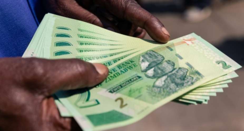 Zimbabwe's economy has been crippled by decades of mismanagement under Mugabe. Galloping hyperinflation has left many struggling with the cost of living.  By Jekesai NJIKIZANA AFP