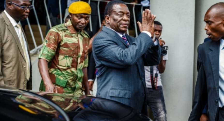 Zimbabwe's President Emmerson Mnangagwa arrives for a visit at the home of late opposition leader Morgan Tsvangirai, who died in South Africa last week, to express his condolences to the family..  By Jekesai NJIKIZANA AFP