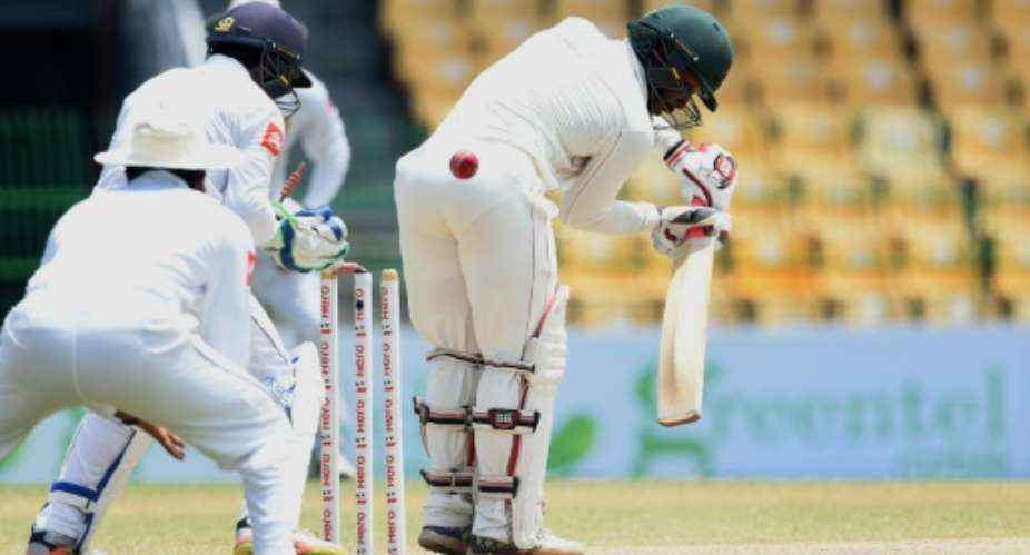 Zimbabwe's Regis Chakabva pictured, R, batting against Sri Lanka in July 2017 hit an unbeaten 71 as West Indies were denied victory in Bulawayo.  By Ishara S. KODIKARA AFPFile