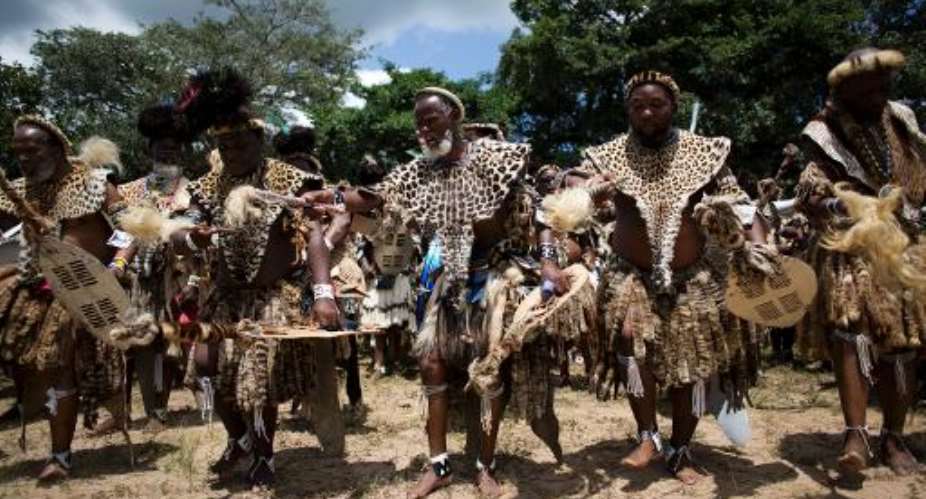 Members of the Shembe Church Nazareth Baptist Church, a traditionalist Zulu church, dance in their leopard-skins to worship God, in Durban, on January 26, 2014.  By Alexander Joe AFPFile