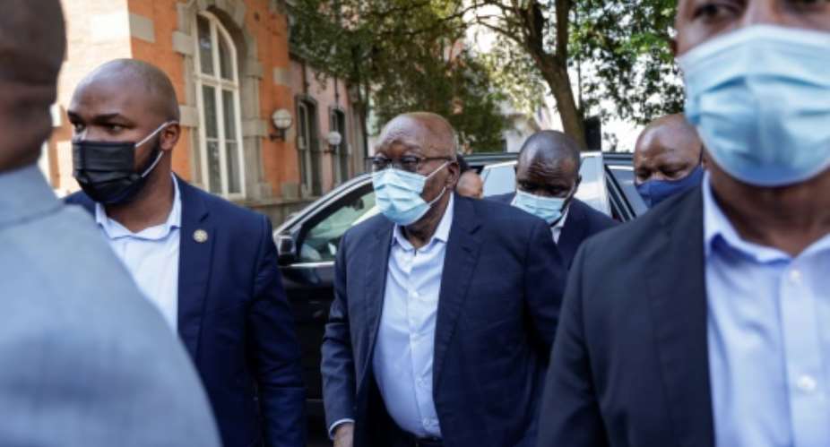 Zuma stepped briskly out of his vehicle and up to the building's entrance surrounded by security personnel.  By Michele Spatari AFP