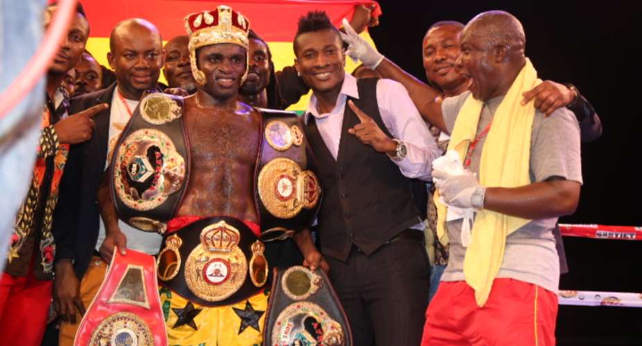 Asamoah Gyan with his boxer after the victory