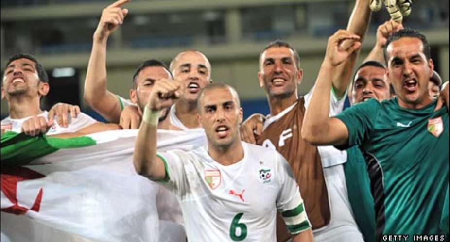 Algeria's players celebrate their famous victory in Cabinda