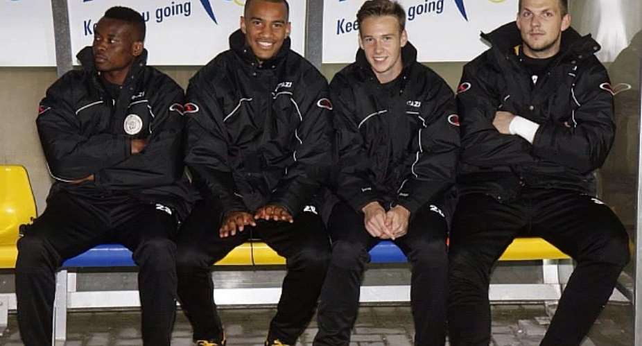Ansah, first from left, watching from the Lokeren bench as they beat Lierse