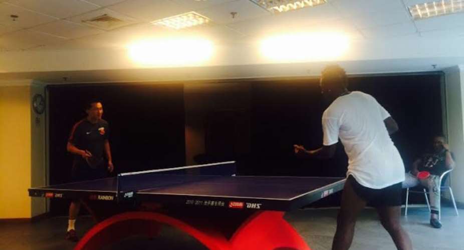 Asamoah Gyan in a table tennis battle with his physical instructor