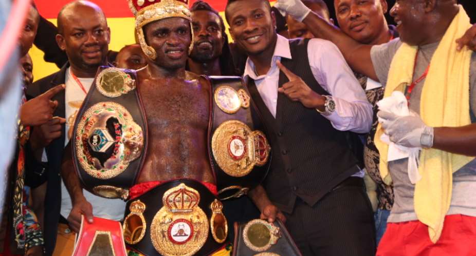 Asamoah Gyan with his boxer after the fight