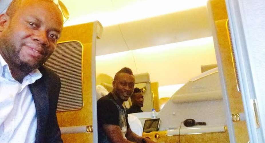 Asamoah Gyan with his brother Baffour and manager Samuel Anim Addo on their flight to Dubai