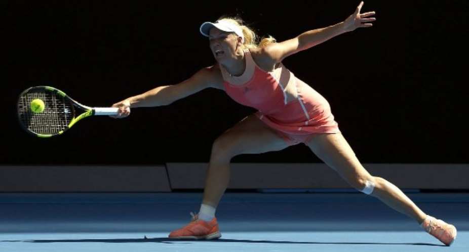 Caroline Wozniacki crashes out at Australian Open, Novak Djokovic and Serena Williams cruise through