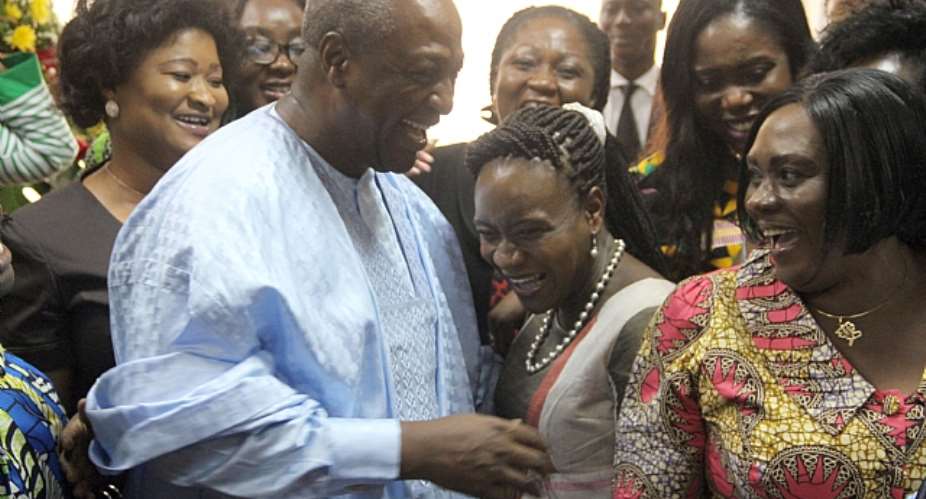 President John Dramani Mahama swarmed by some female MPs in Parliament yesterday