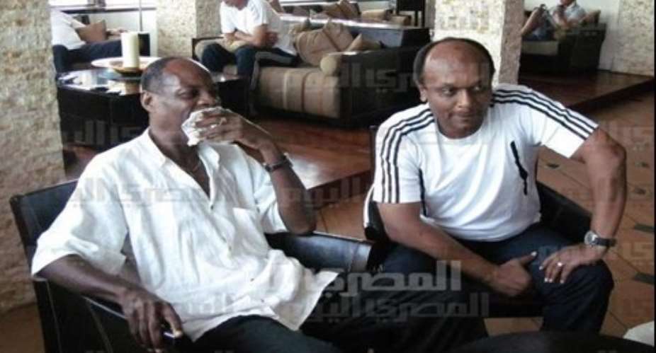 Emmanuel Quarshie left and a Zamalek official in a meeting